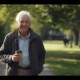 Segment 6 – Paul’s Recovery Story Senior man in his early 70s walking confidently in a park, smiling, wearing casual clothes, holding a thermos cup of coffee, fresh morning sunlight, greenery around, atmosphere of vitality and hope, realistic cinematic photography, 16:9